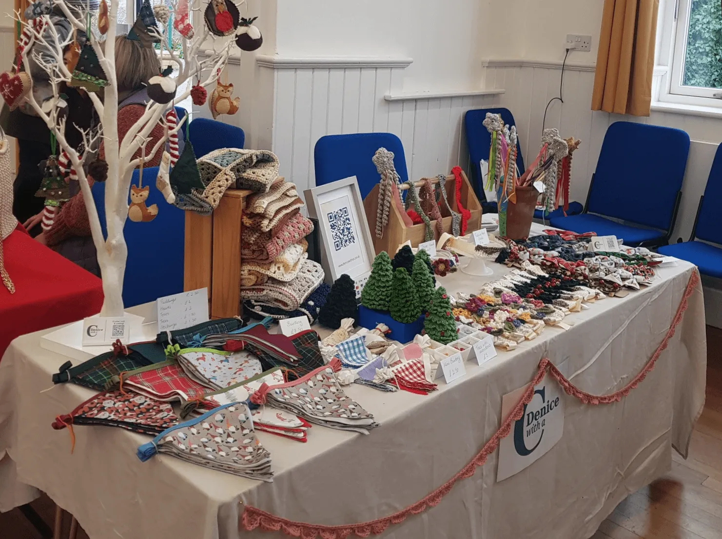 Craft fayre stall, containing a variety of croched and textile items for sale